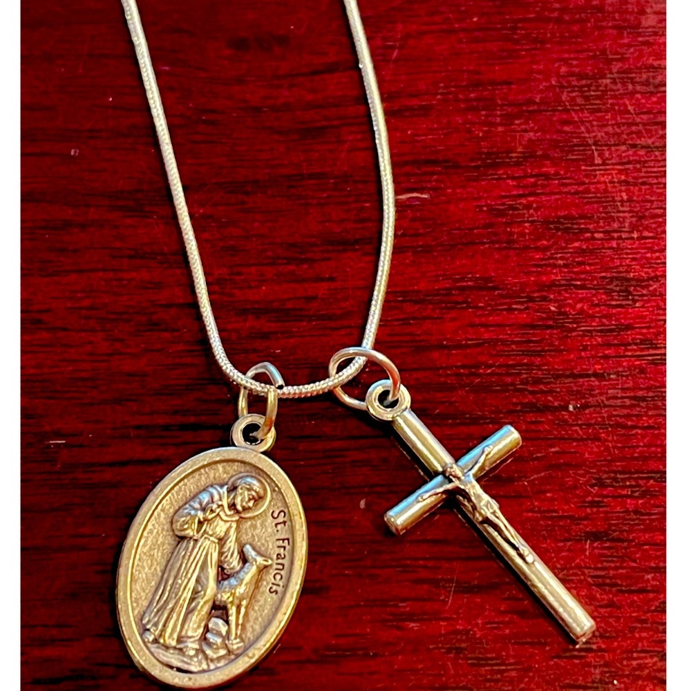 Sterling silver plated 18” with a St. Francis medal and crucifix.